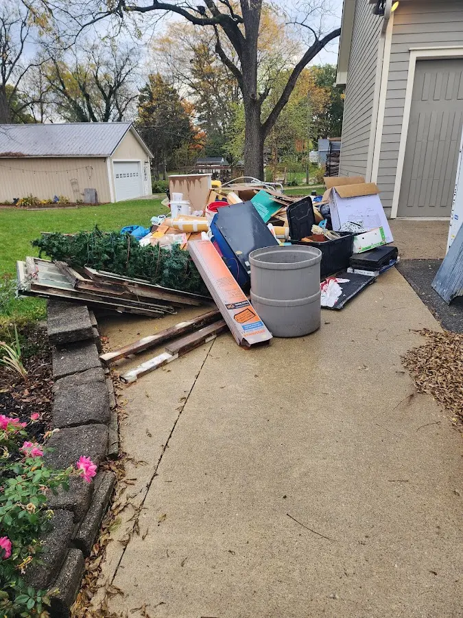 Dumpster being loaded with debris for 10 Yard Dumpster Rental in Euharlee